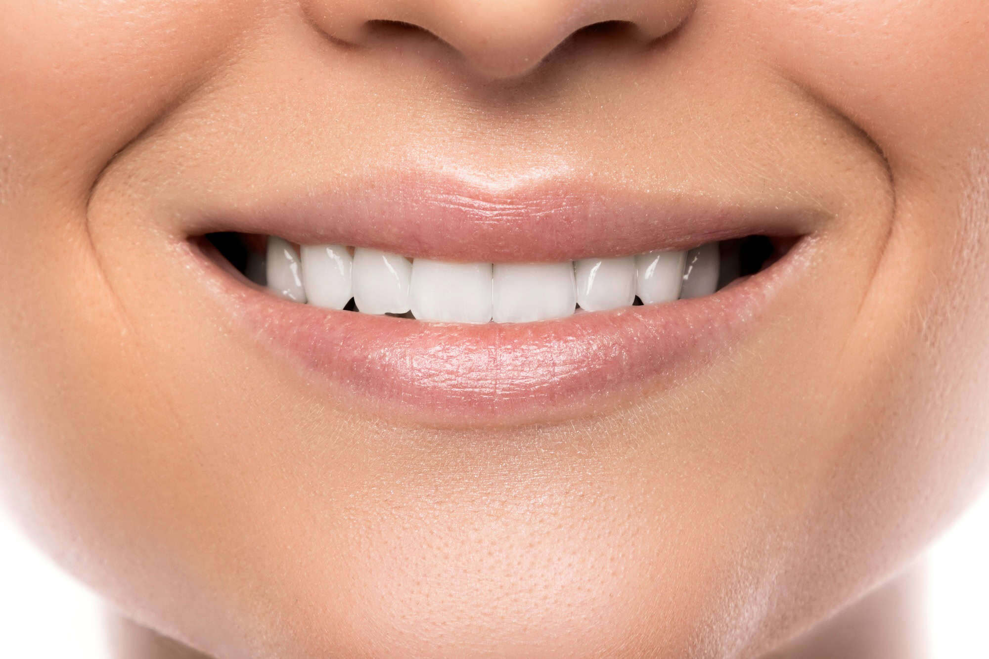 Closeup of beautiful female smile with white teeth