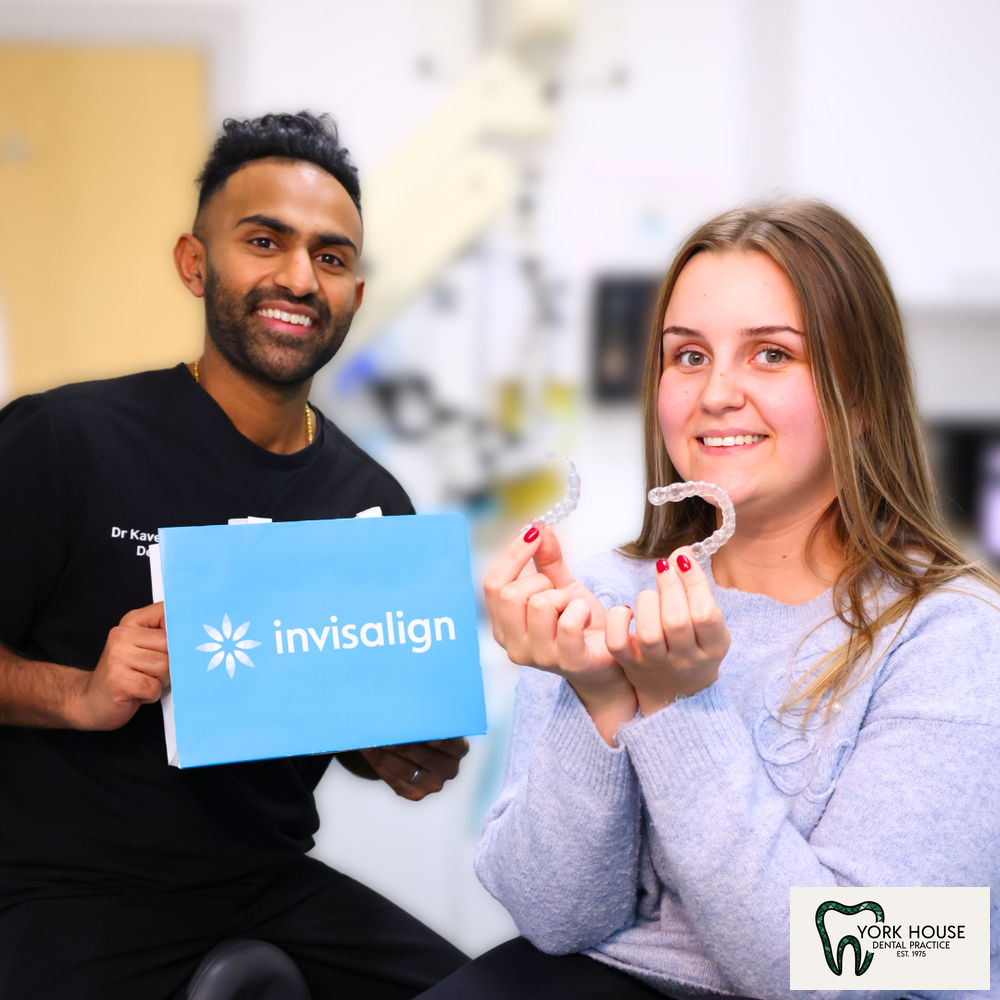 Dr. Kaveet Patel with patient reviewing Invisalign clear aligners at York House Dental Practice, West Byfleet, Surrey